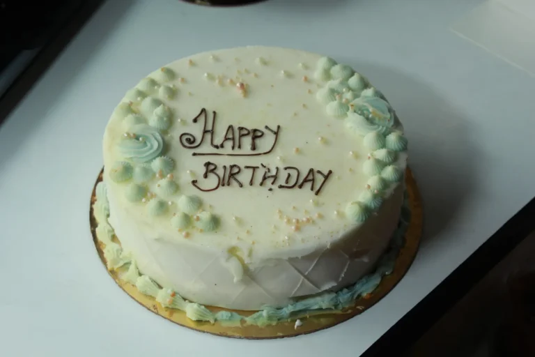 Happy Birthday cake with cream rosettes